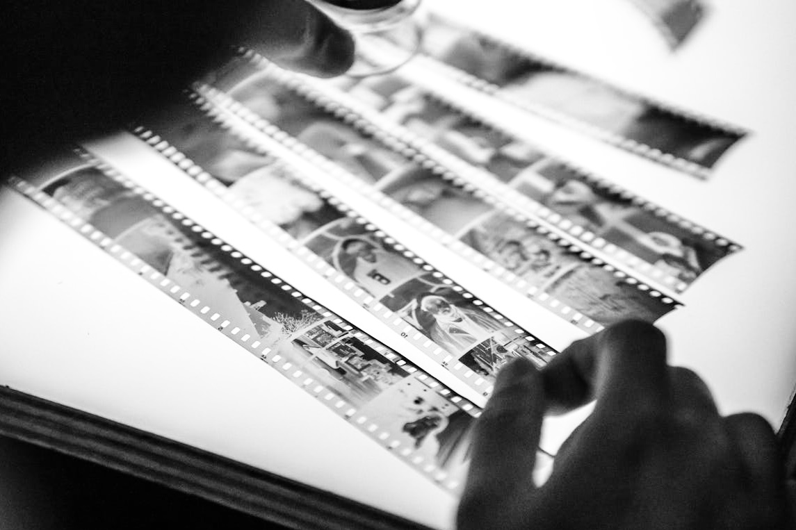 Image displays film negatives on a backlit glass plate to demonstrate to the visitors of Brantford Film Lab's website that we develop and process film in Brantford Ontario